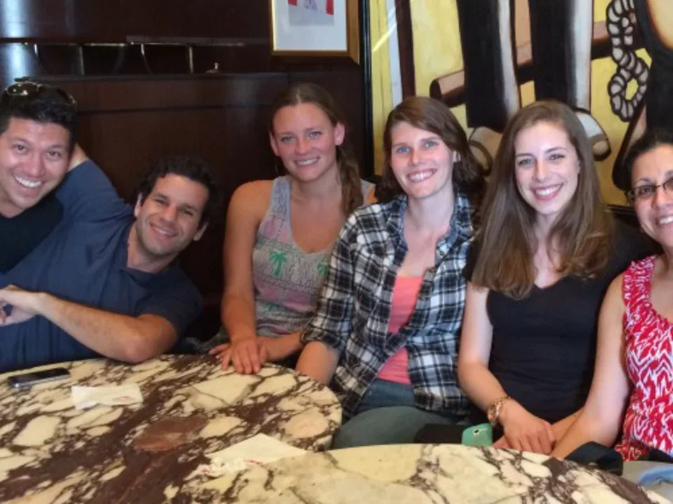 Teitell lab members sitting close to one another at a restaurant table