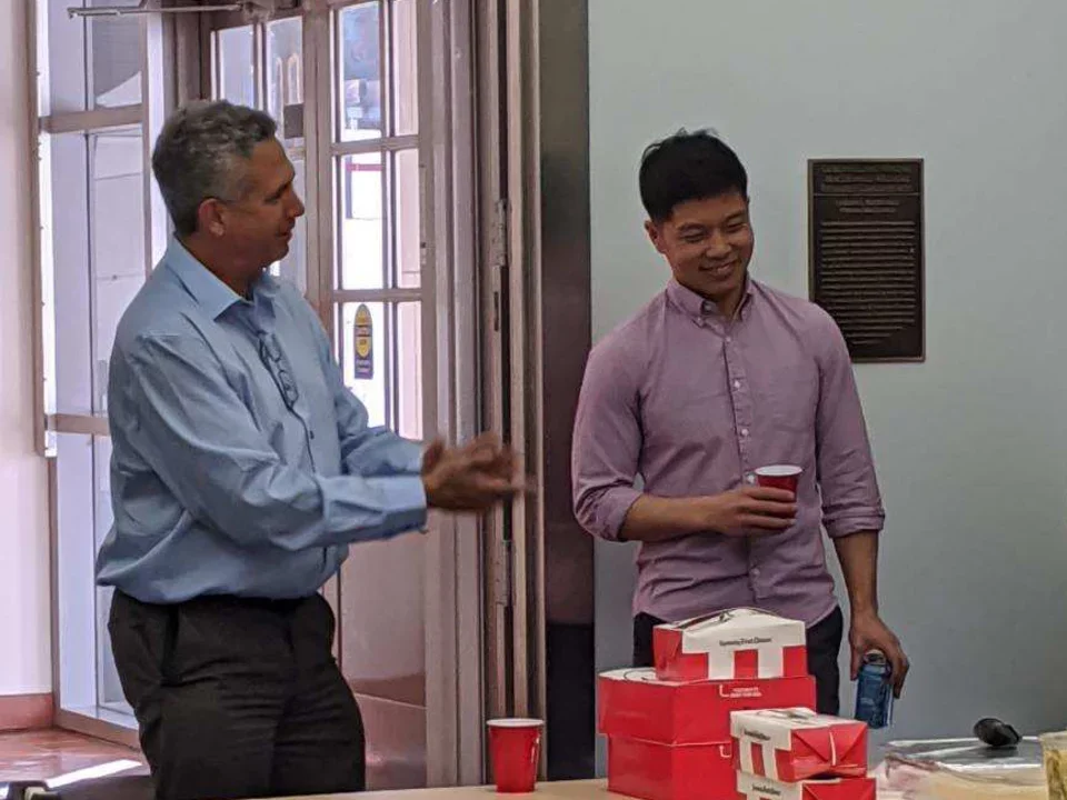 Dr. Teitell applauds a grad student who has just successfully defended his PhD
