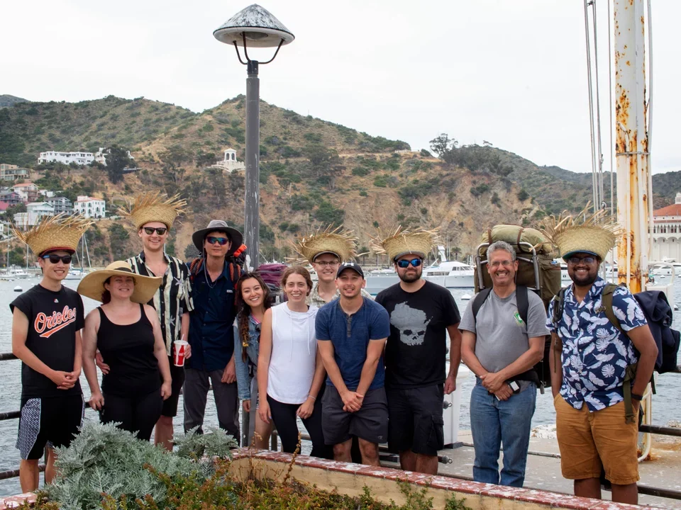 Teitell lab members stand on a pier on Catalina Island on a lab retreat in 2019. 