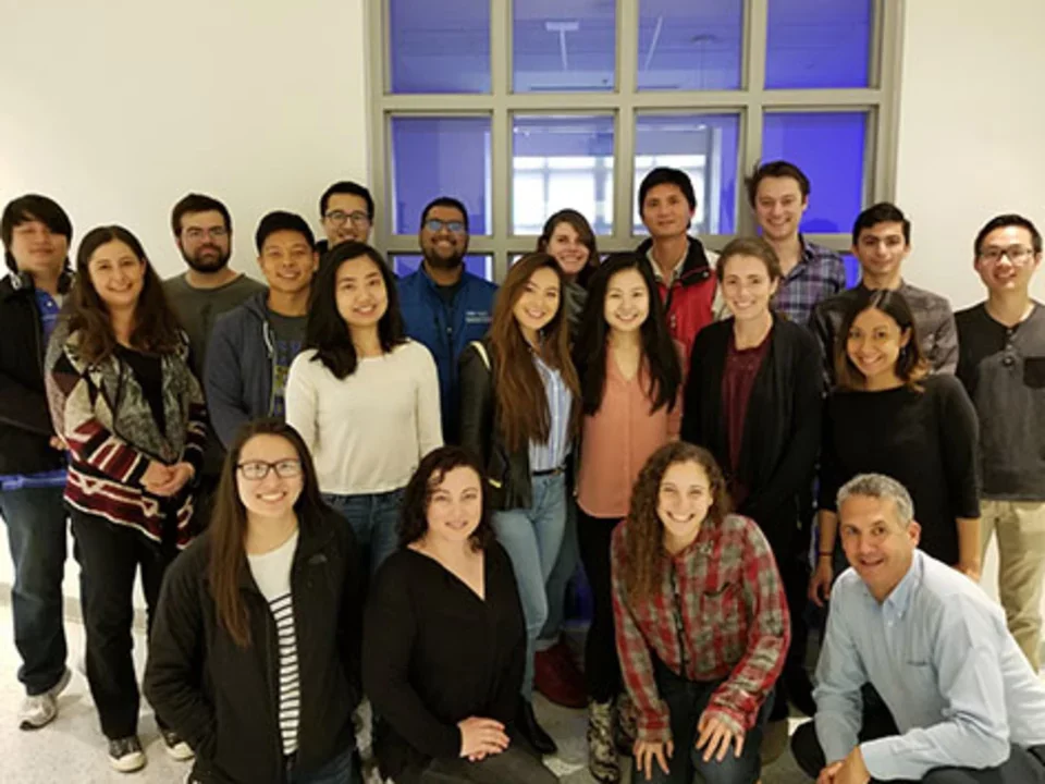 The teitell lab in 2018, about 15 people, they gather inside in front of the conference room