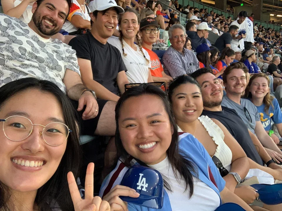 Teitell Lab members sit in the stands at a Dodgers game